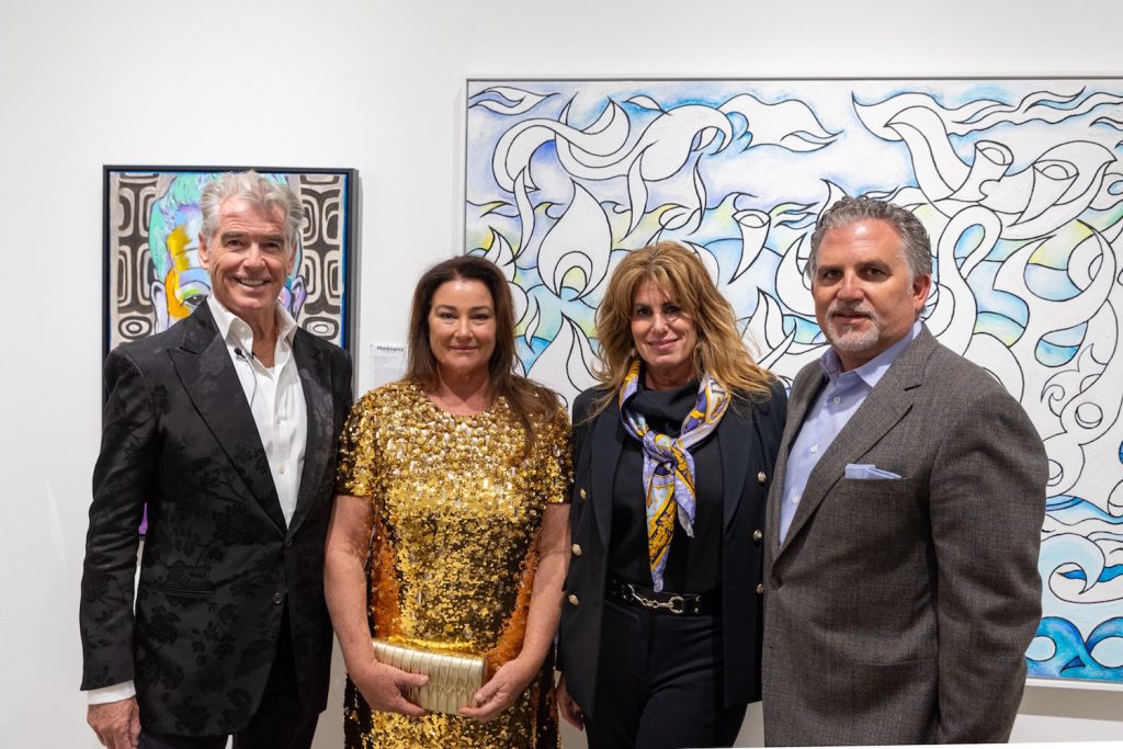 L to R: Pierce Brosnan; Keely Shae Brosnan; Art Miami directors Pamela Cohen and Nick Korniloff at Art Miami opening night.