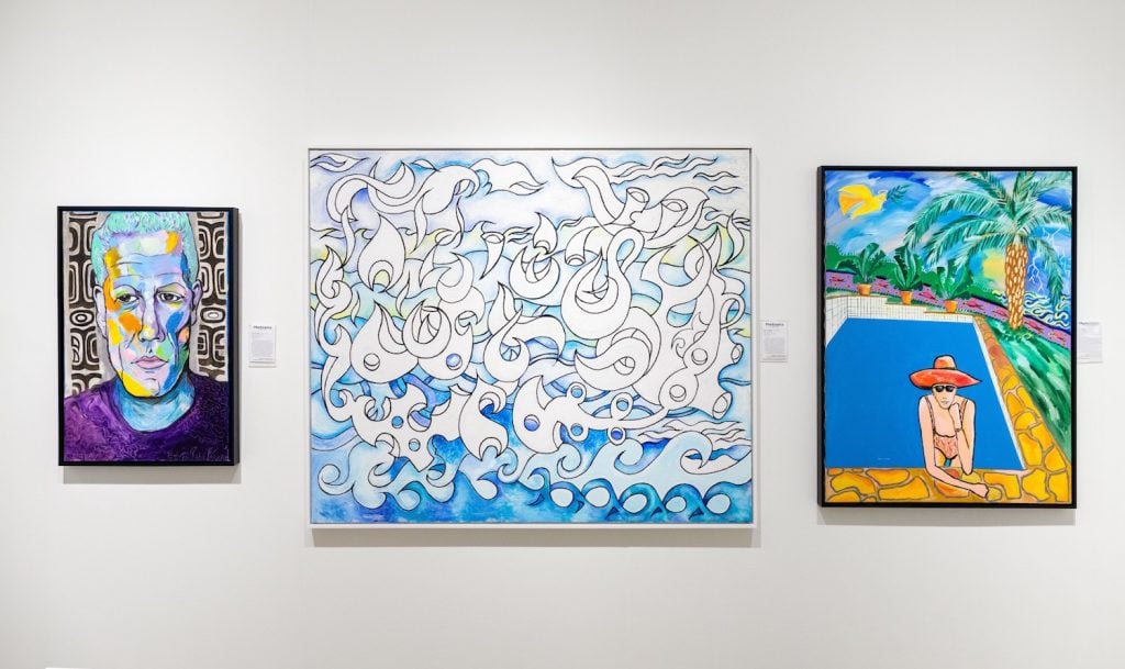 Installation view of paintings by Pierce Brosnan at Art Miami 2023.