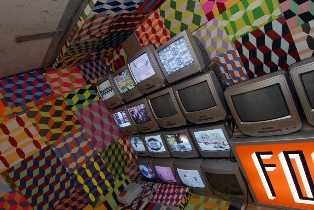 photo showing stack of computers by artist Barry McGee