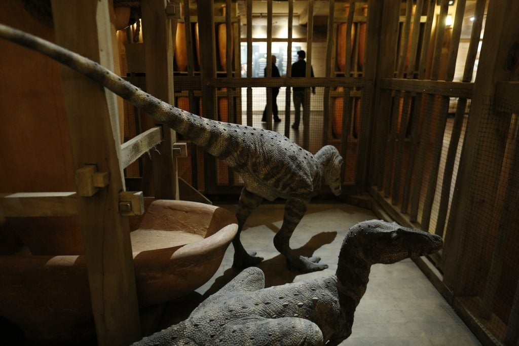 Replica dinosaurs are pictured in a cage onboard a life-size replica of Noah's Ark