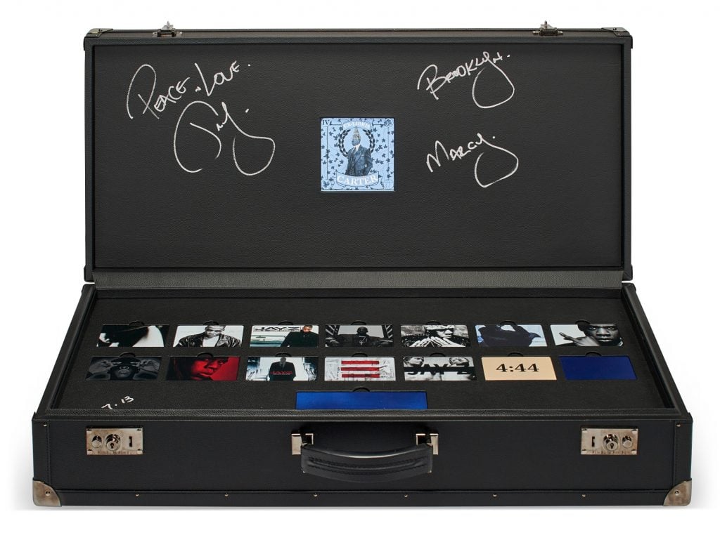 Jay-Z is auctioning off this briefcase filled with custom metal library cards showcasing his album artwork.