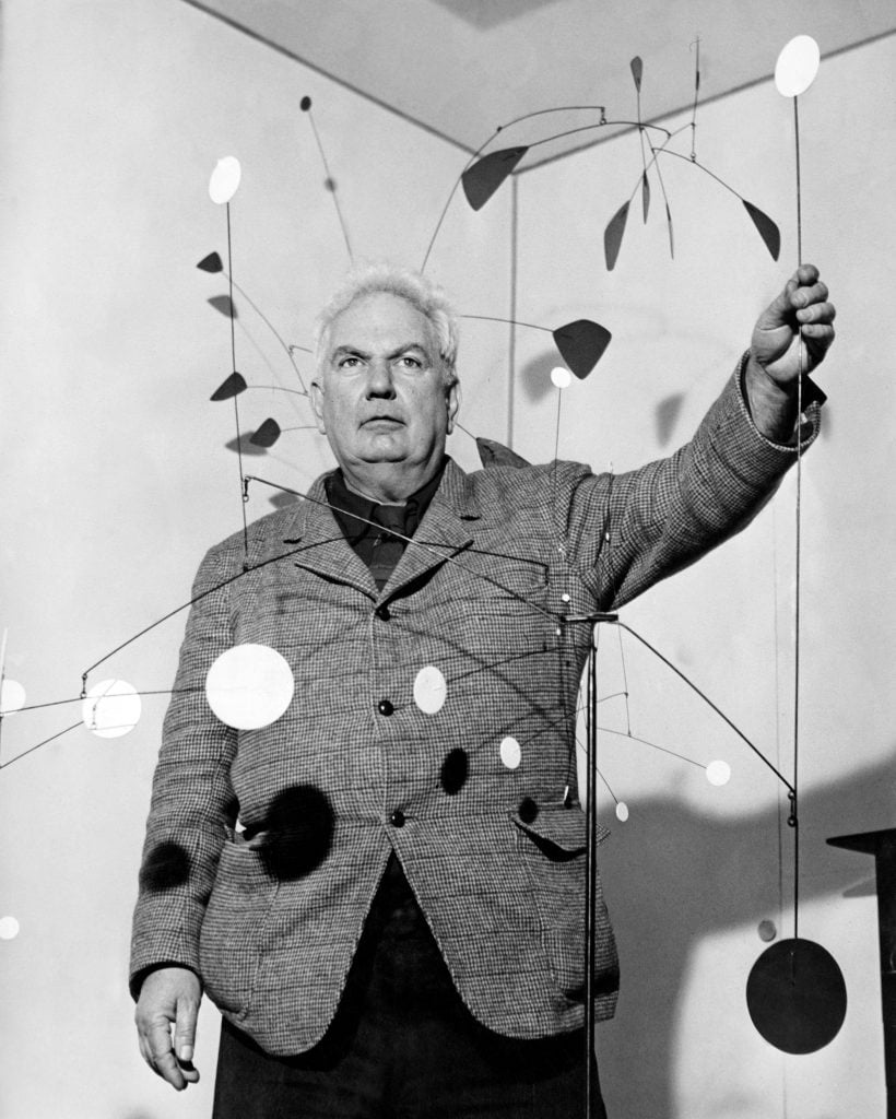 Alexander Calder at the opening of an exhibition of his mobiles at the Galleria Dell'Obelisco in Rome, Italy, in 1956. (Photo by Keystone/Hulton Archive/Getty Images)