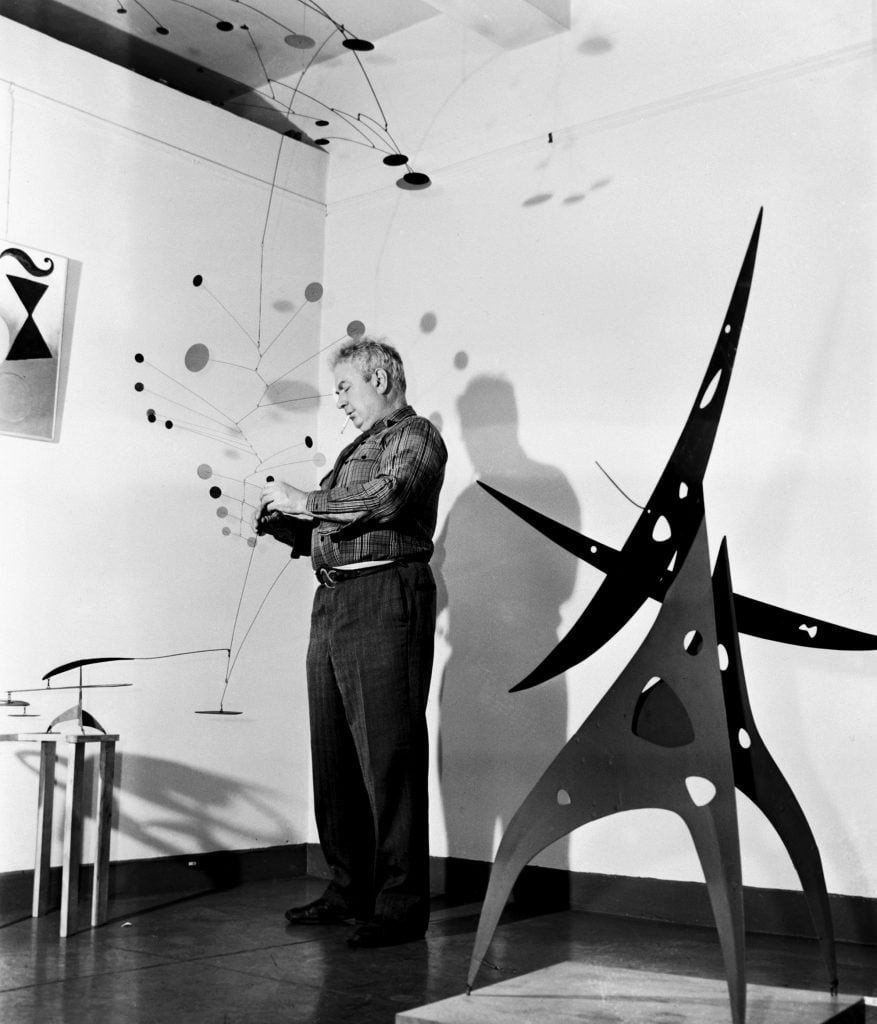 Alexander Calder with <em>Gamma</em> (1947) and <em>Sword Plant</em> (1947). 