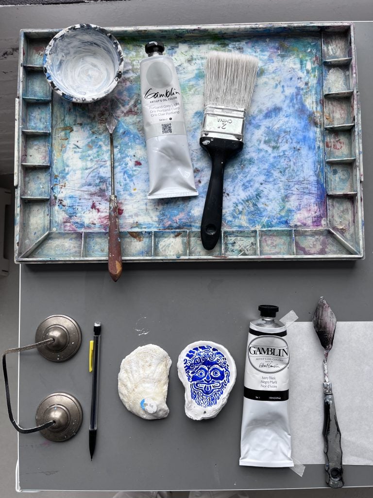 Hull's painting table at his Bronx studio, with Gamblin paint and the oyster shells he often includes in his works. Courtesy of the artist.