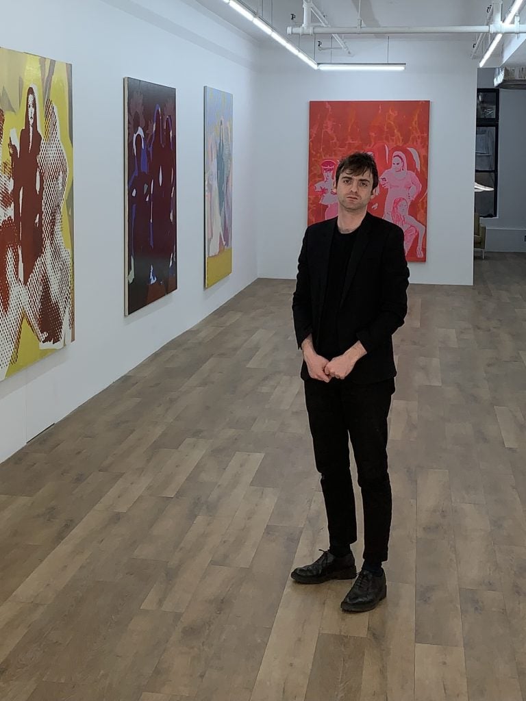 LOMEX dealer Alexander Shulan at his gallery during artist Andrea Fourchy's 2021 exhibition Girlfriends. Courtesy of Alexander Shulan.