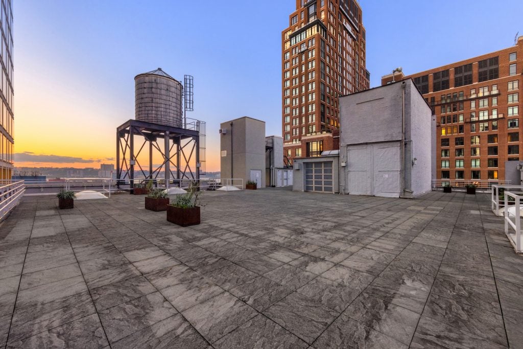 The rooftop at 548 West 22nd has Hudson River views and looks out over the Chelsea gallery district and High Line park.Interior view of the building at 548 West 22nd Street, formerly the home of the Dia Art Center. <br>Photo by Tim Waltman of Evan Joseph Studio. Image courtesy Serhant.