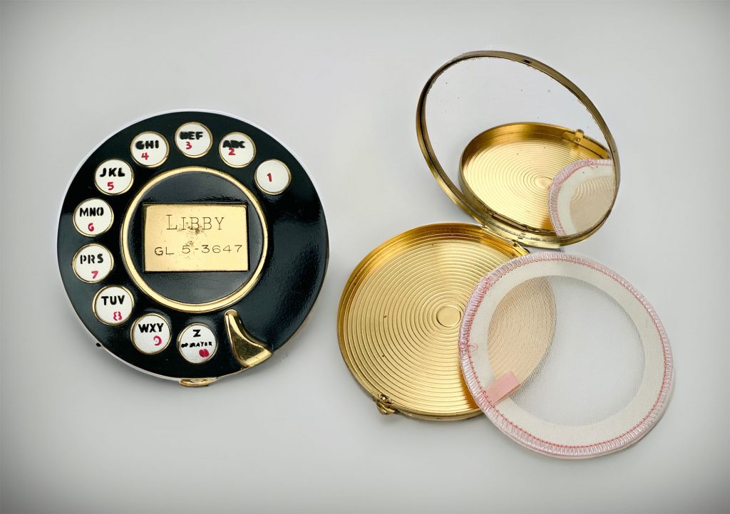Elsa Schiaparelli and Salvador Dalí, telephone dial powder compact (ca. 1950s), black enamel, brass and glass, $1,500. 
