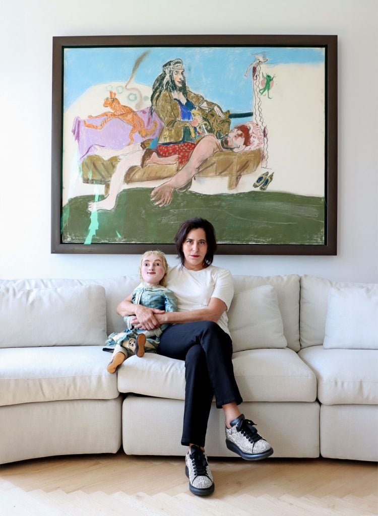 Portrait of Kim Manocherian with Paula Rego's Scheherazade behind her.