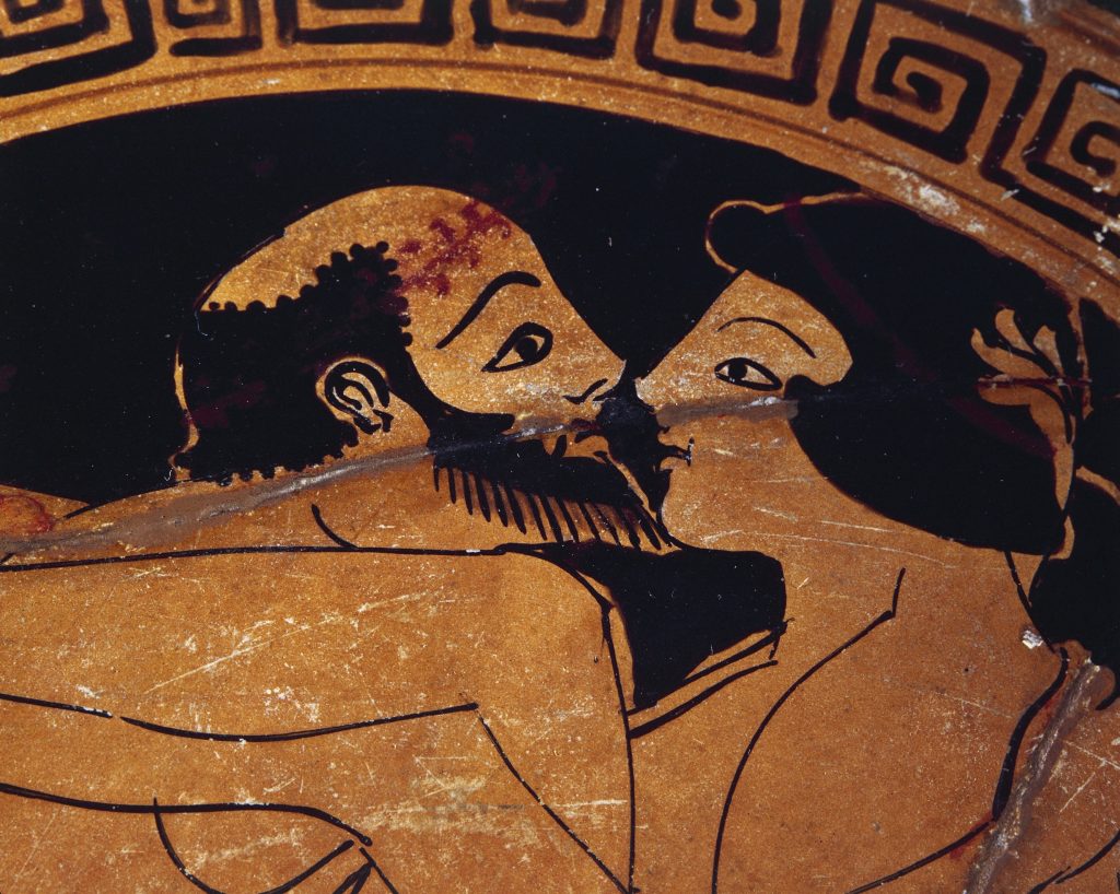 Detail shot of a greek bowl decorated with an erotic scene of a kiss between lovers