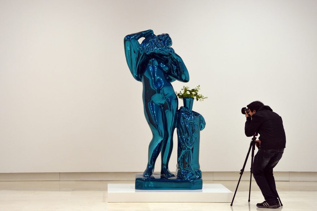 Jeff Koons's Metallic Venus on view in "Empire State. New York art now" at the Palazzo delle Esposizioni, Rome, 2013. Photograph by Gabriel Bouys/AFP via Getty Images)