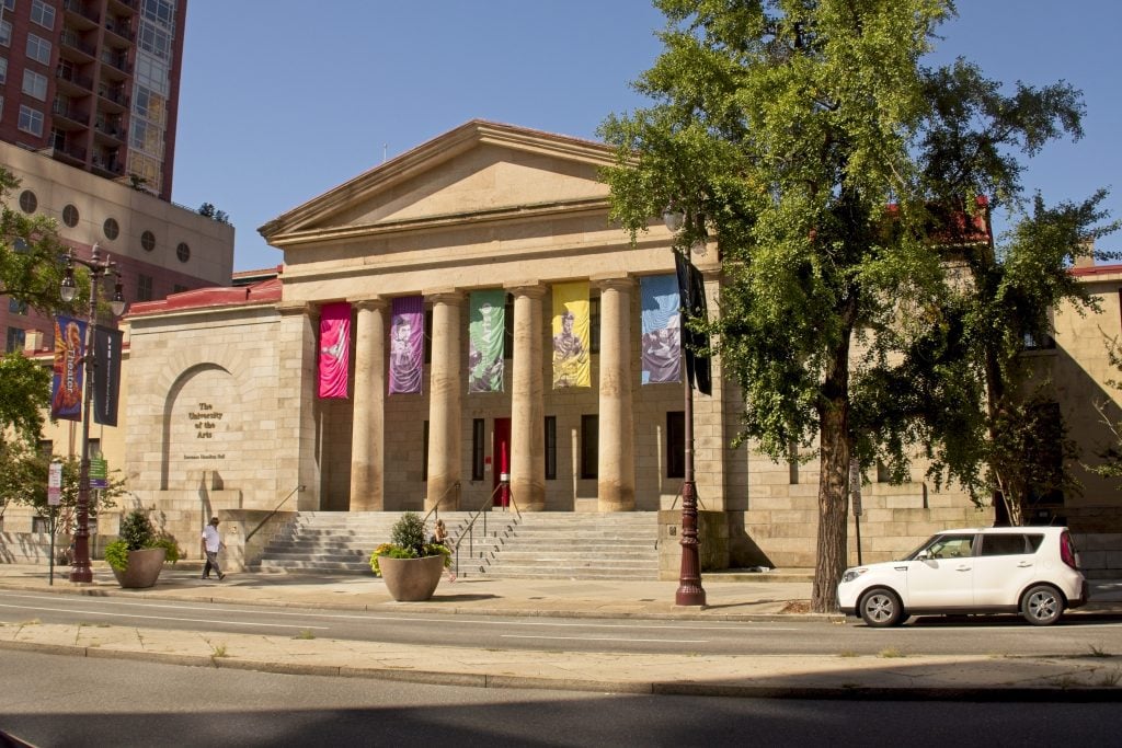 A photograph of a classical building on the campus of Philadelphia's University of the Arts on a blue-skied afternoon.