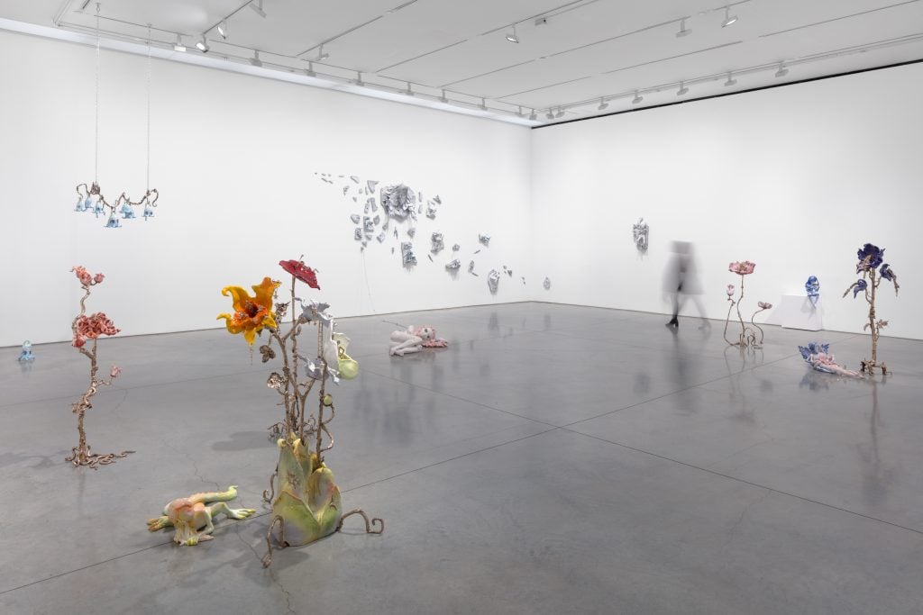 An installation view of flower sculptures by artist Apollinaria Broche.