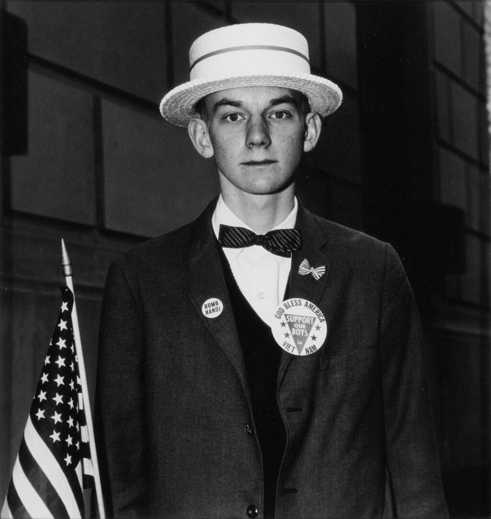 Diane Arbus, <i>Boy With Straw Hat</i> (1967). Est. $15,000–$20,000.