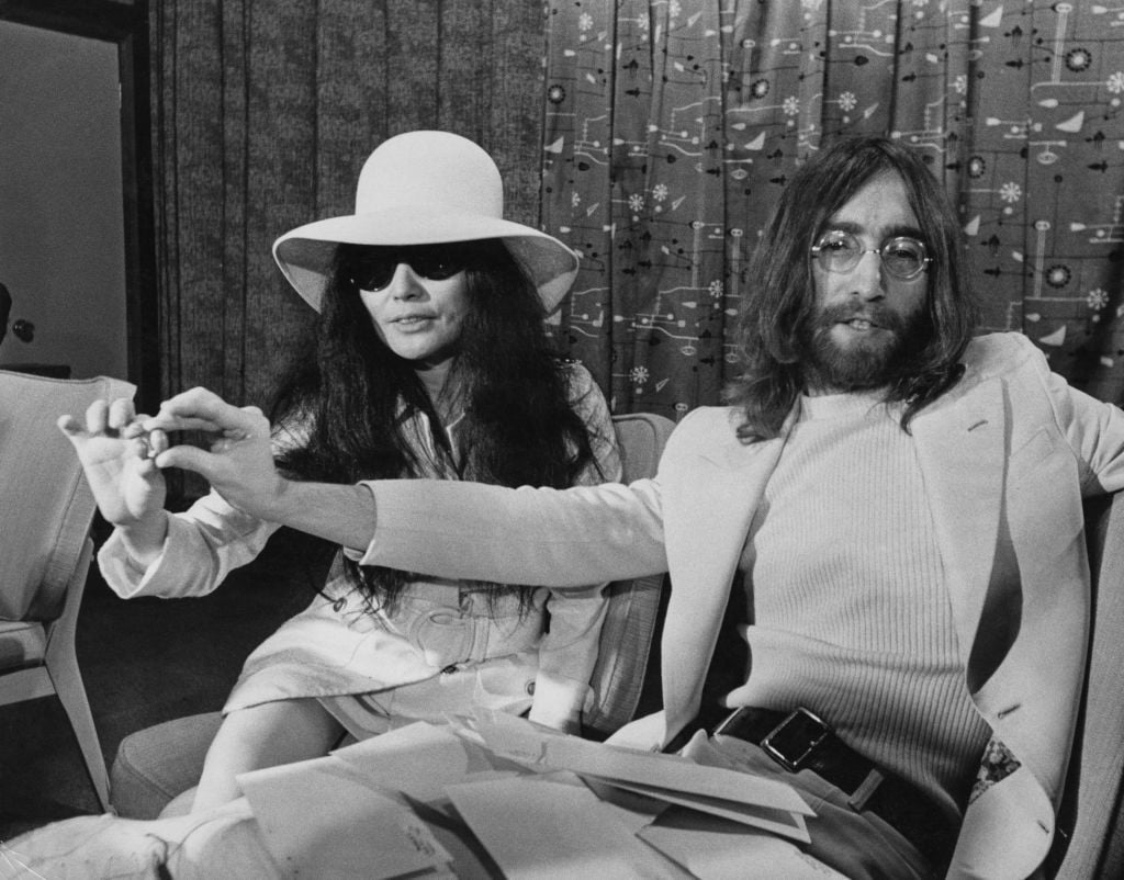 John Lennon and Yoko Ono are pictures holding acorns they planted as part of a living monument to peace.