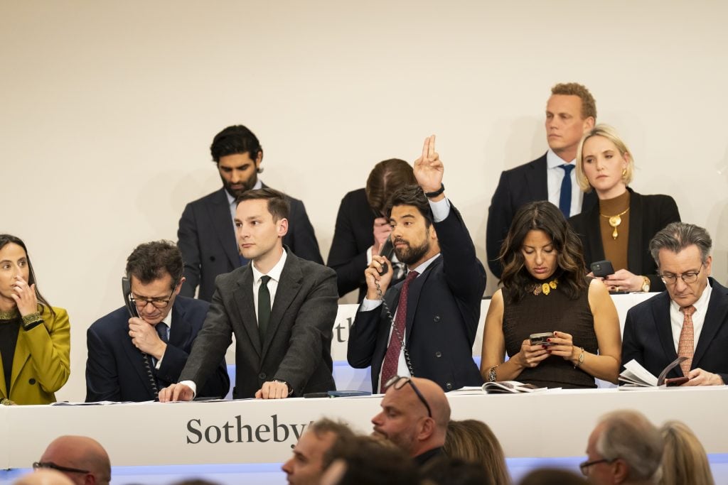 Sotheby's specialists take bids over the phone in the London sale room. Photo: Haydon Perrior, courtesy of Sotheby's.