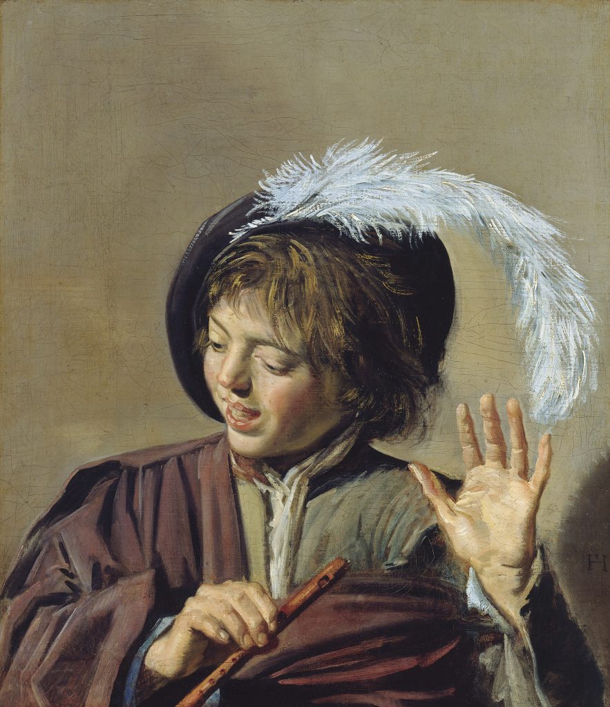 In a color photo of a painting, a boy holds a flute in one hand, while gesturing with the other. He wears a hat with a white feather.