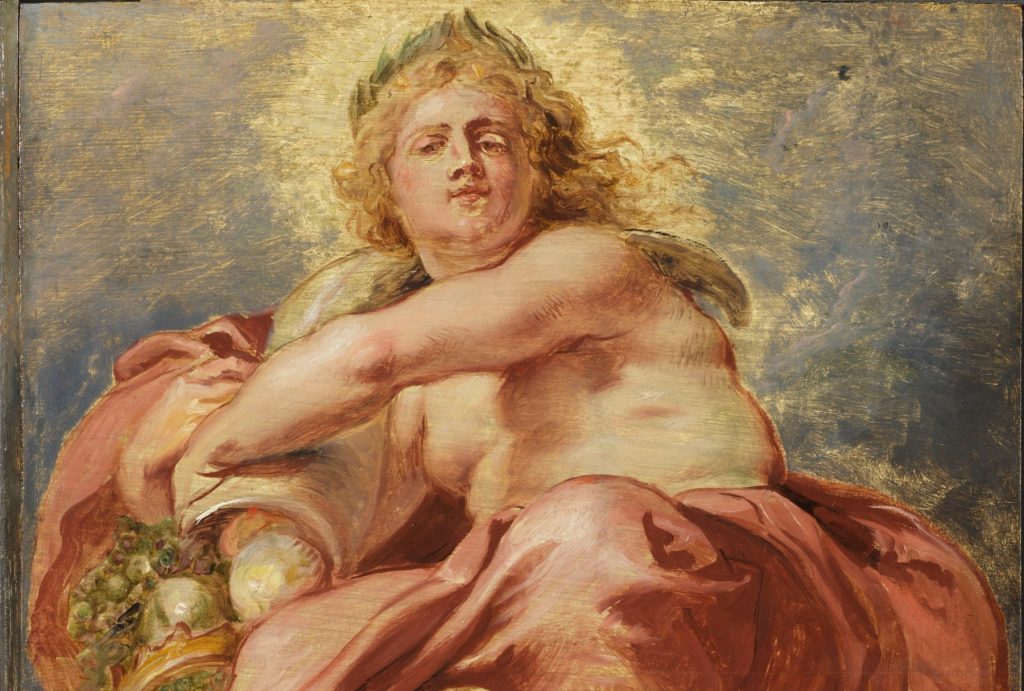 a painted semi-naked woman clings to something while light shines around her head