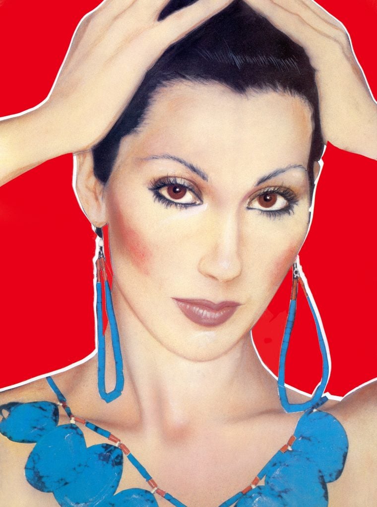 Cher's face is airbrushed, with emphasis on her high cheekbones and thin eyebrows. Her light complexion is stark against a bright red background.