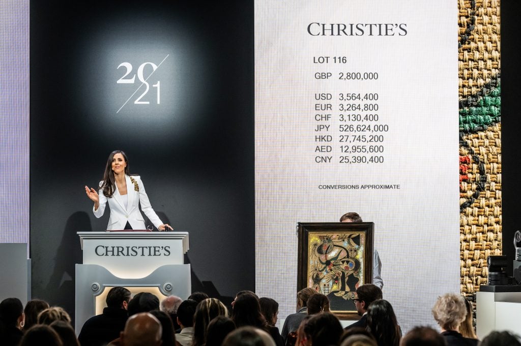 Auctioneer Veronica Scarpati at Christie's Art of the Surreal Evening Sale in London.