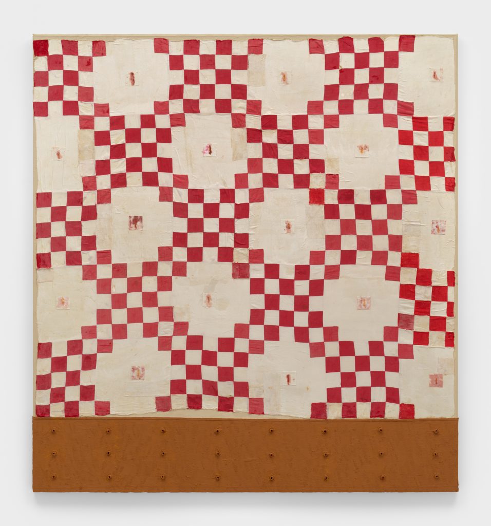 A painting that looks like a quilt hanging at The Whitney Biennial by Harmony Hammond