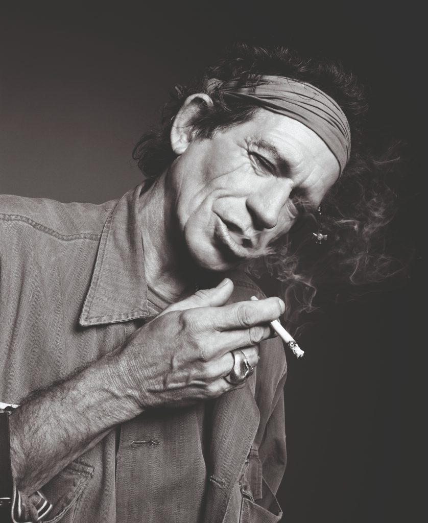 black and white photo of a man smoking
