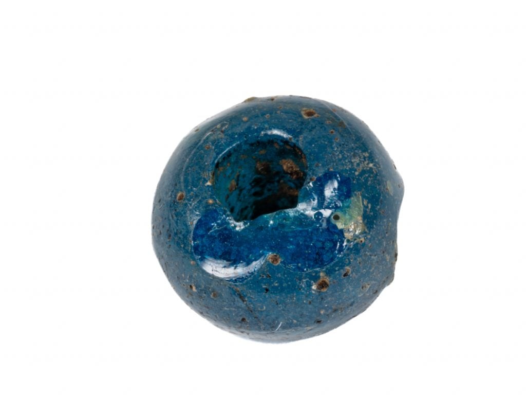 A blue glass bead.