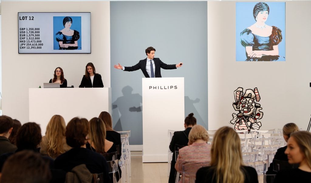 At Phillips London, Auctioneer Henry Highley sells the top lot of the sale, Andy Warhol's Portrait of Princess Diana