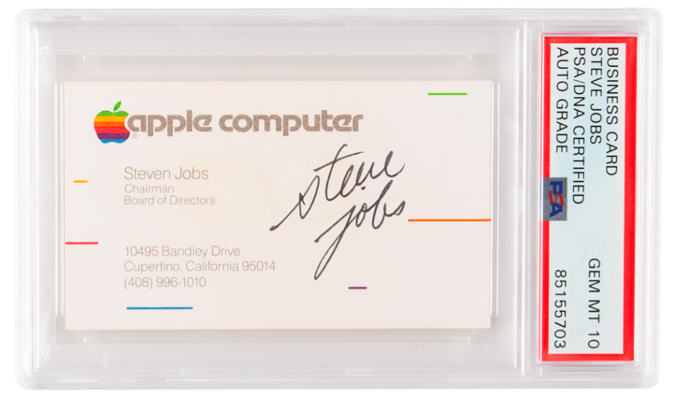 A business card with a rainbow Apple logo, signed by Steve Jobs.