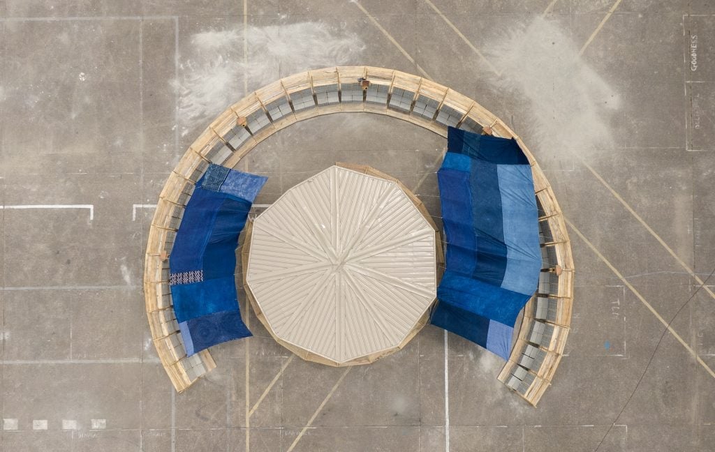 An overhead view of a circular pavilion in a plaza