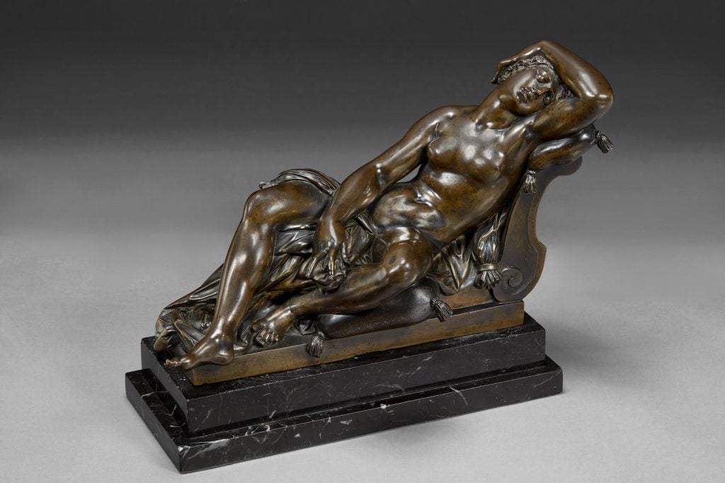 an image of a sleeping nymph by Giambologna, a renowned Italian Renaissance artist. The nymph is depicted in bronze gracefully reclining with her eyes closed