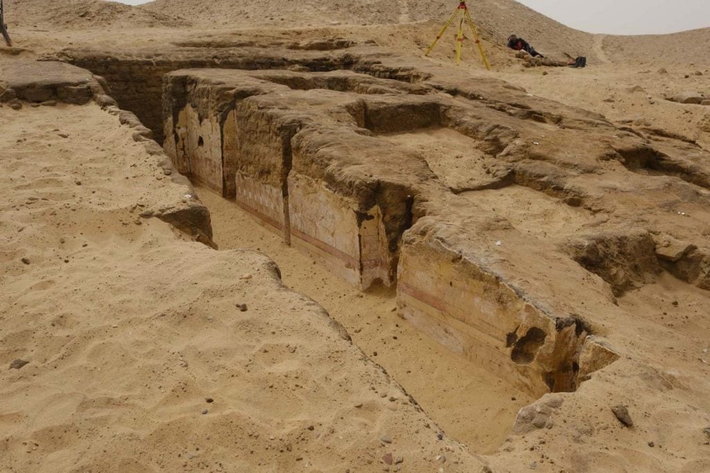 a partially excavated tomb in the desert