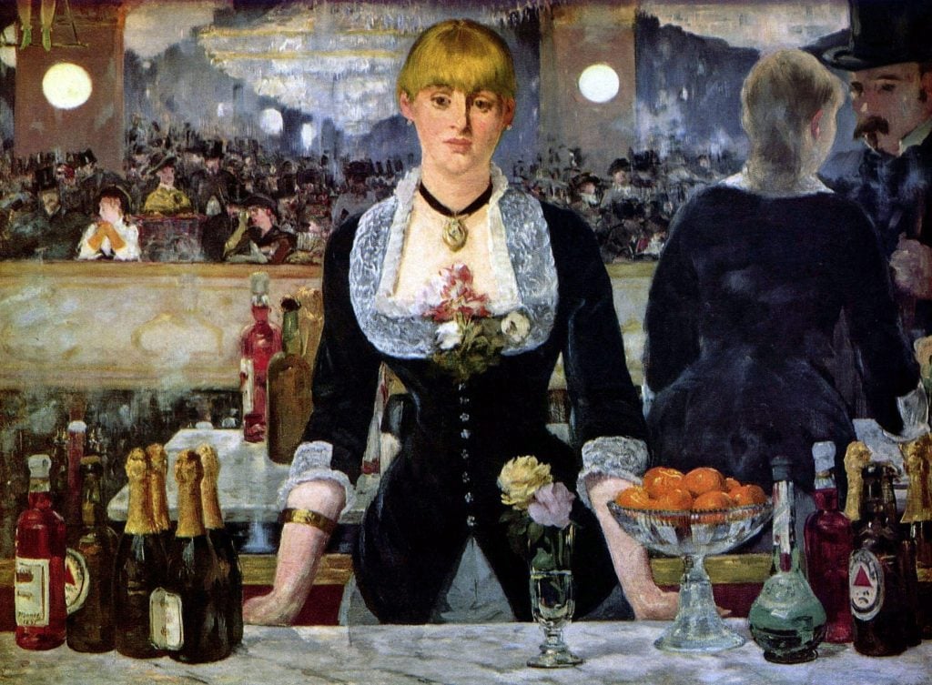 a bar maid stands at the counter of the paris nightclub wearing a black dress trimmed in lace, staring directly at the viewer
