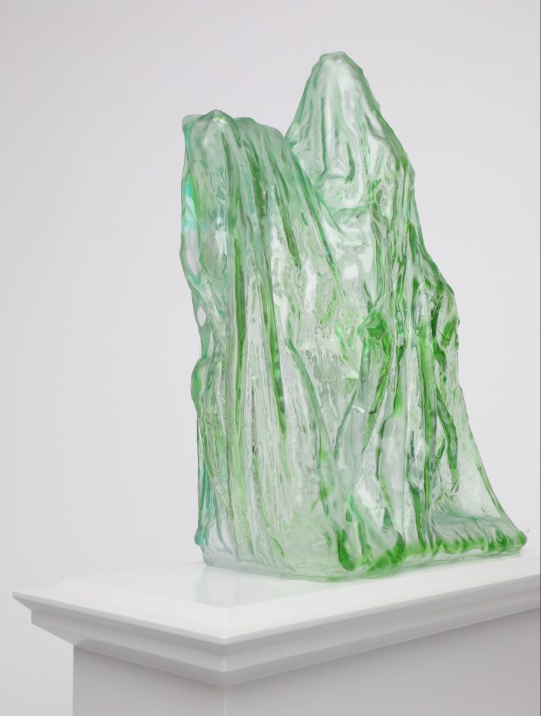 A shrouded equestrian statue – translucent, pale green