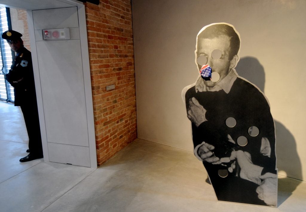 cut out sculpture b y cady noland on a man with hole punches on his body and eyes and mouth