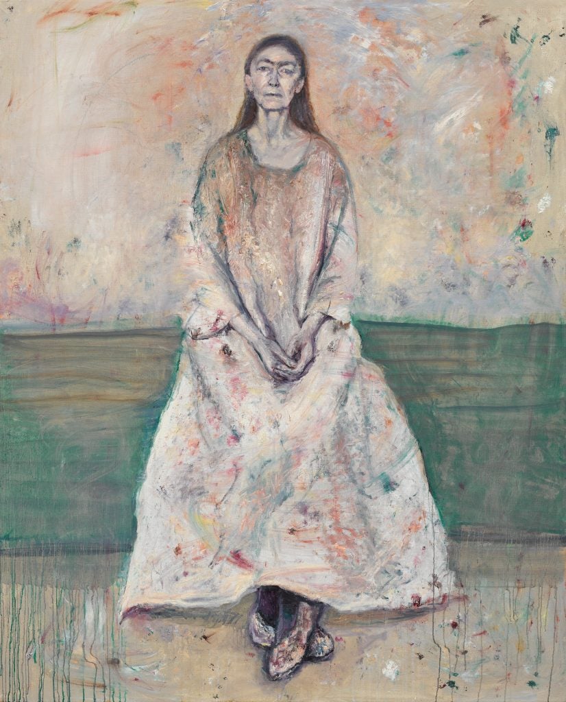 painting of artist celia paul sitting with her feet crossed and hands on her lap
