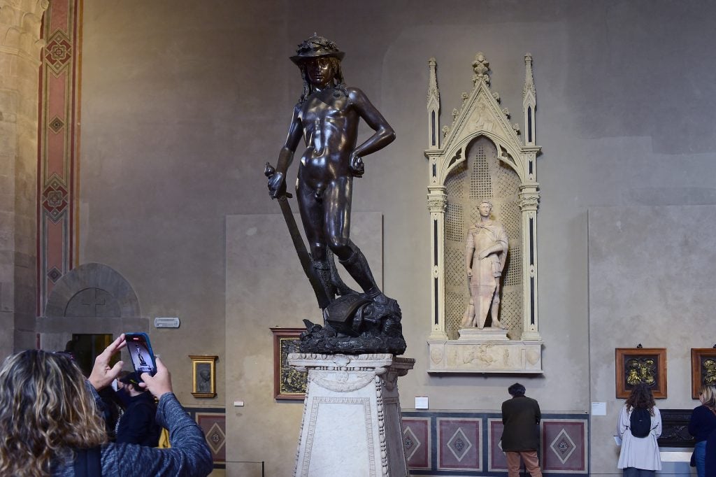 A gallery in Bargello Museum showing Donatello's nude bronze sculpture David.