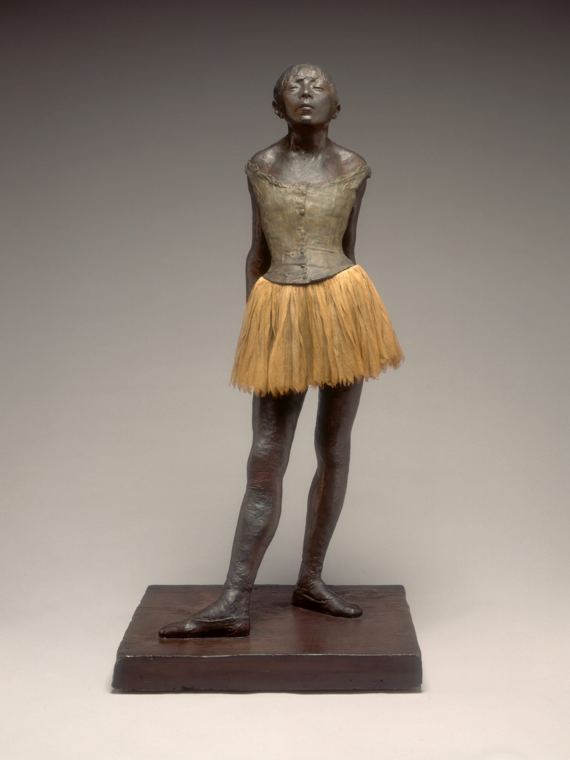 Edgar Degas's sculpture "Little Dancer Age Fourteen," where a girl in a tutu stares defiantly at the viewer