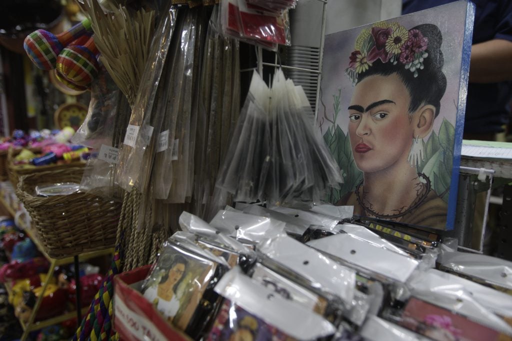 photograph of souvenirs in a mexican market with the image of frida kahlo