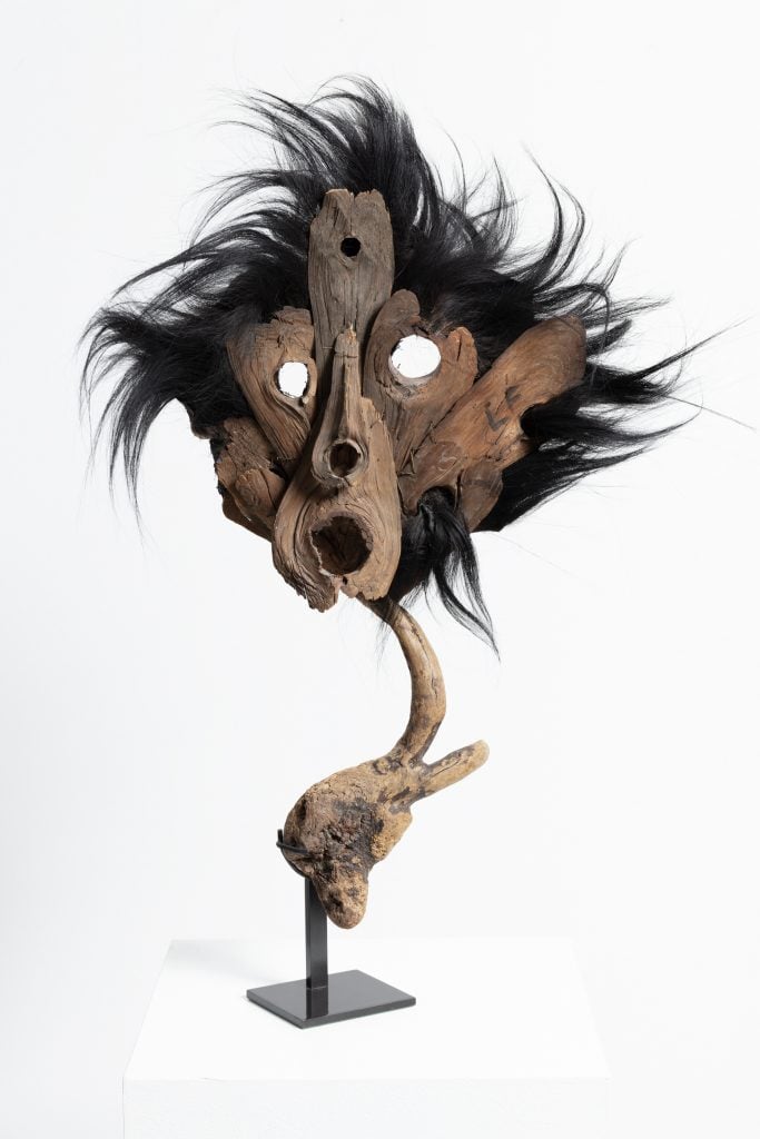leonor fini sculpture of a mask with black thick felt fabric and driftwood tree branch (found in Corsica)