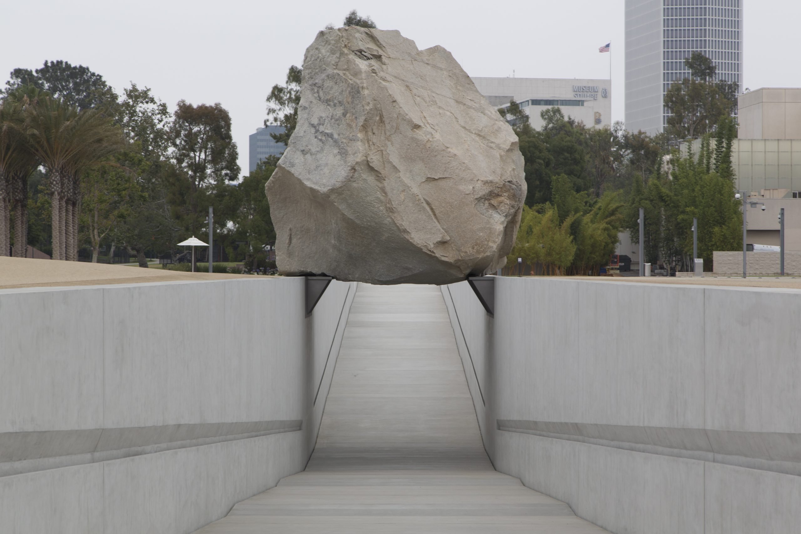 Michael Heizer's "Levitated Mass" sculpture, featuring a massive rock sculpture is poised above a trench