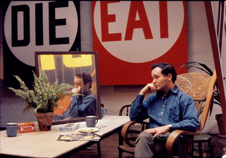 Artist Robert Indiana in his studio with artworks reading "die" and "eat."
