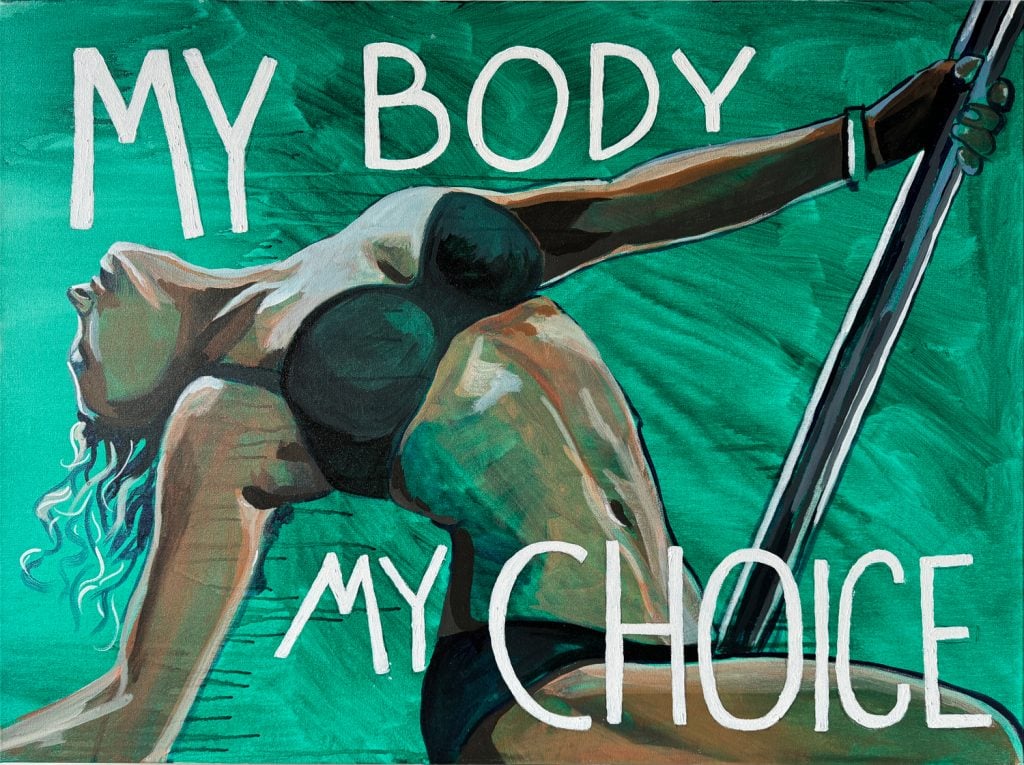 A photograph of a painting where a woman pole dances in her underwear on a simple green background with white text reading "my body my choice"