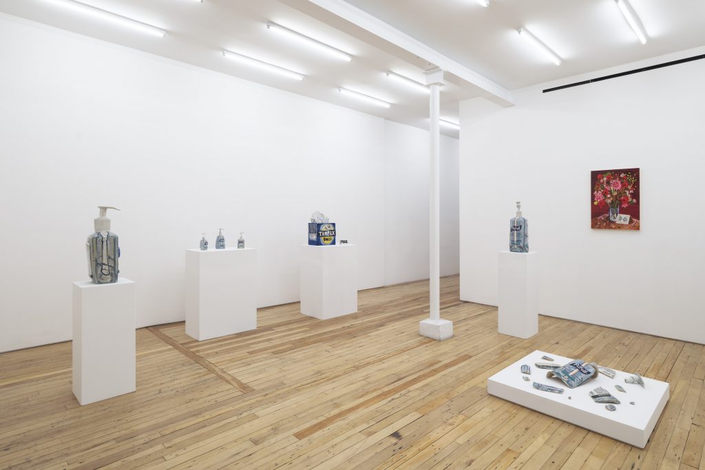 a view of a gallery room with sculptures of Purell hand sanitizer on pedastals