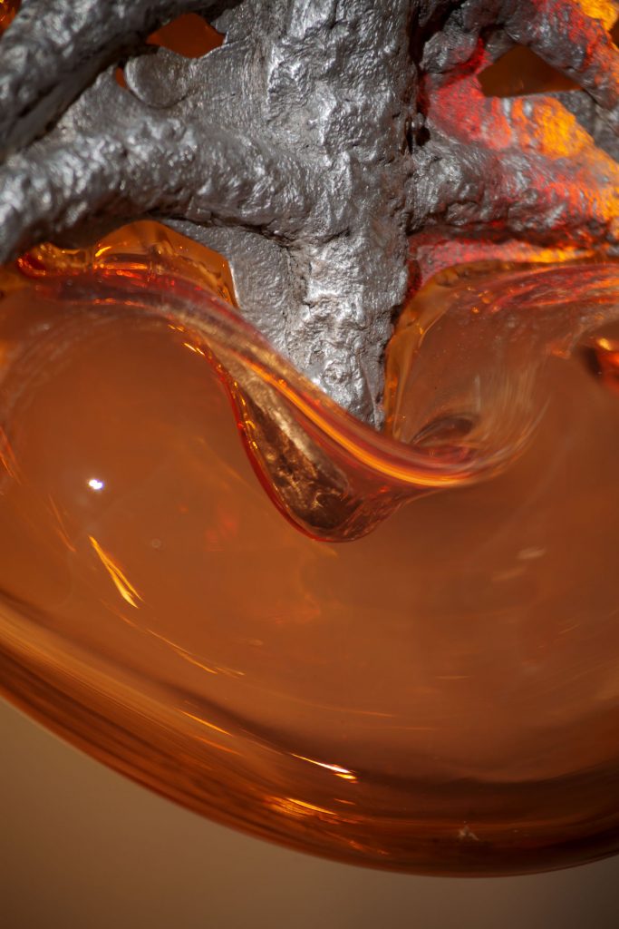 close up view of blown glass and twisted metal