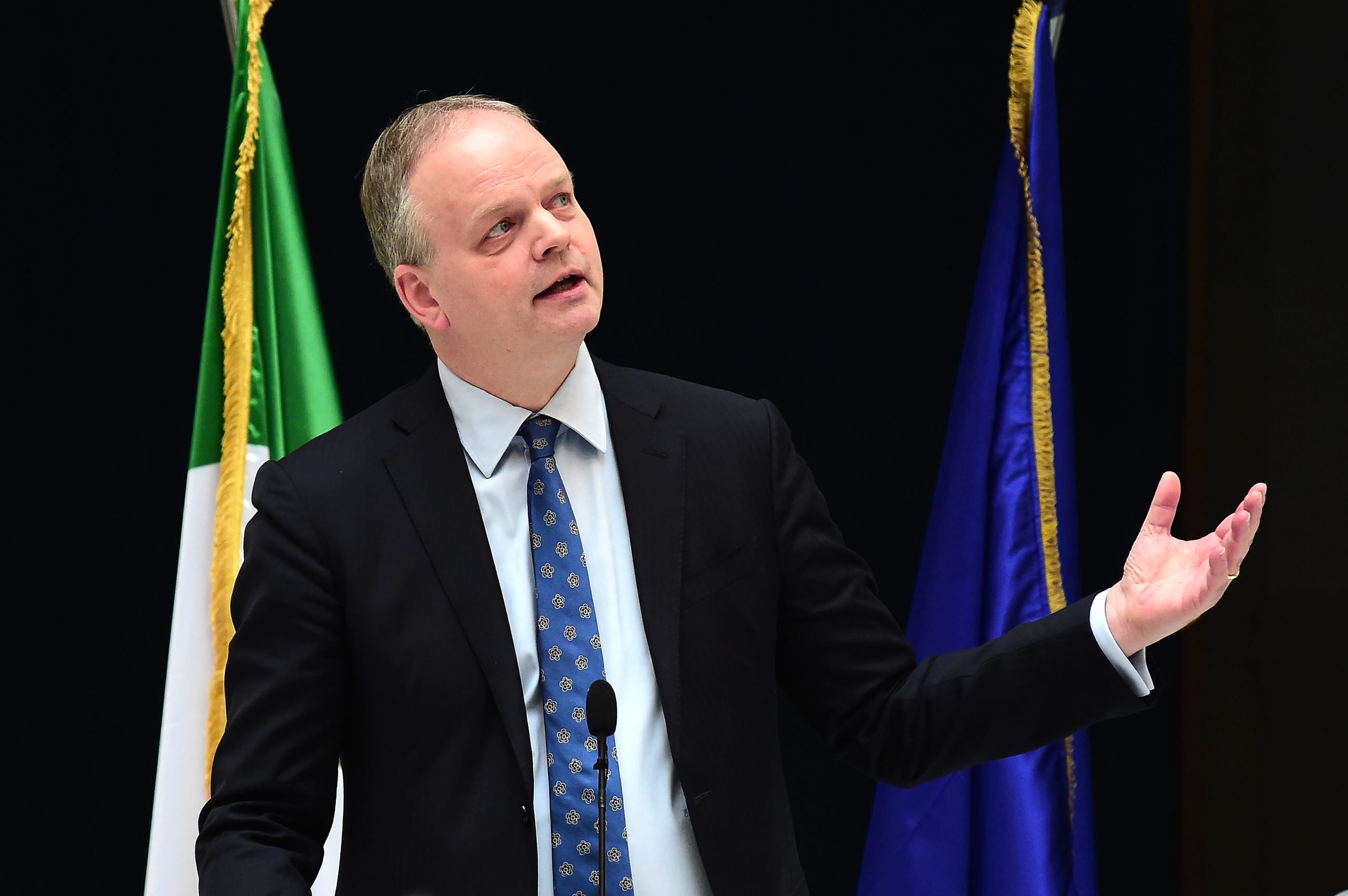 The image shows a man in a suit and tie named Eike Schmidt.