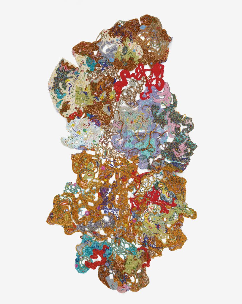 a multicolored work of painted copper in good, red, blue, and purple