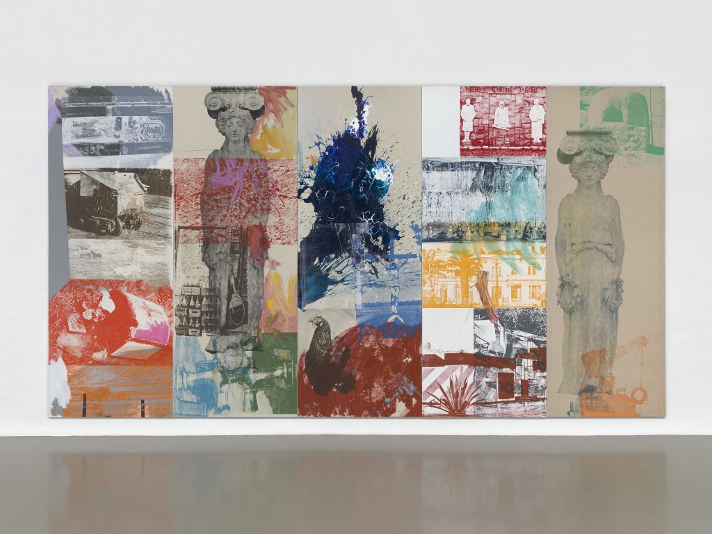 A large abstract painted and printed canvas by Robert Rauschenberg. It features photos of two Ancient Greek columns, a chicken, and gestural brushstrokes in dark blue. 