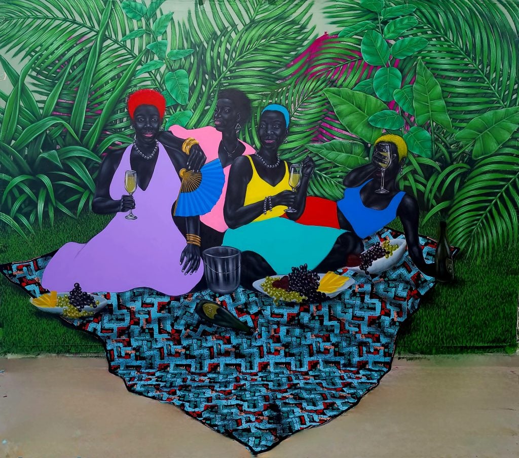 a collaged artowrk features four Black women reclining in front of lush plants