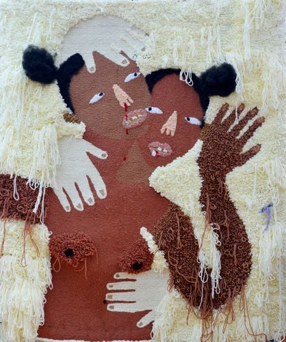Two nude black collage figures against a background of white yarn.