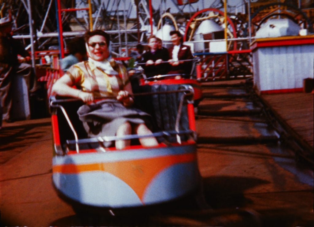 A woman takes a ride in a Coney Island amusement park